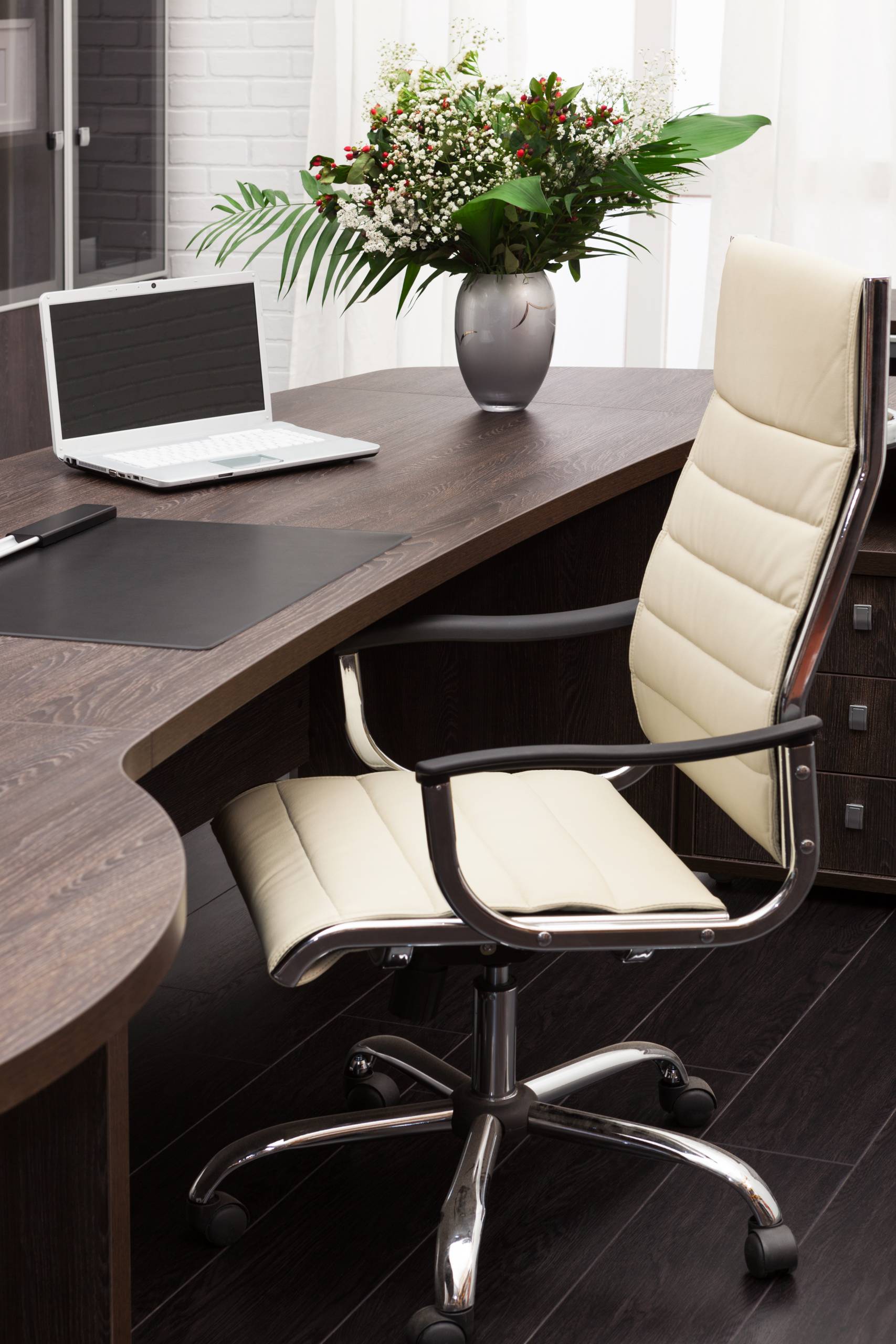 laptop on a desk in a modern office